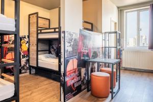 Postel nebo postele na pokoji v ubytování a&o Antwerpen Centraal