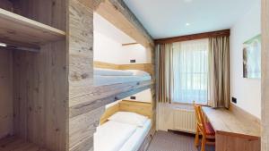Postel nebo postele na pokoji v ubytování Hotel - Restaurant - Sonnblick