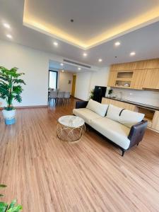 a living room with a couch and a table at FLC Sunny Beach Quy Nhon Apt in Quy Nhon