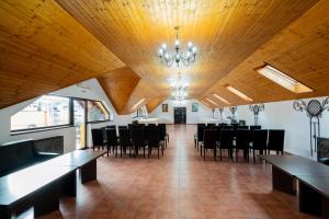 a large dining room with tables and chairs at MAX International Hotel in Râşnov