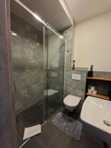 Ένα μπάνιο στο Apartament Holiday MiS