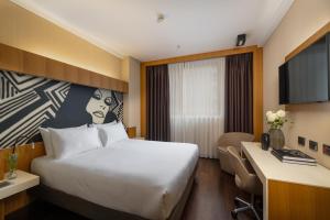 Posteľ alebo postele v izbe v ubytovaní Crowne Plaza Milan City by IHG
