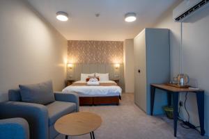 Postel nebo postele na pokoji v ubytování Saffron Boutique Hotel