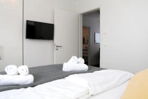 Ένα ή περισσότερα κρεβάτια σε δωμάτιο στο Ferienhaus Diemelblick 19 - besonders familienfreundlich mit Terrasse, Sauna und Garten für 4 Gäste
