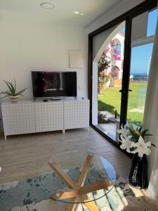 Μια τηλεόραση ή/και κέντρο ψυχαγωγίας στο Mary Playa 1 direkt am Meer Playa del Inglés