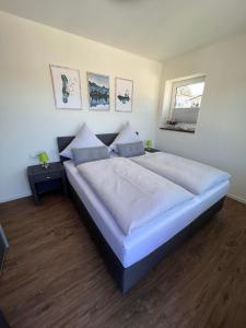 a bedroom with a large bed in a room at Ferienhaus Diemelblick 39 mit Hund - direkt am Diemelsee mit Sauna, Terrasse und Garten für bis zu 5 Personen in Diemelsee