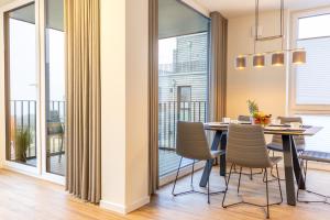 Balkón nebo terasa v ubytování BeltBlick 22 - Stilvolle Ferienwohnung mit Sauna direkt an der Ostsee!