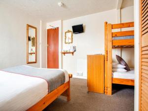 a bedroom with a bunk bed and a bunk bed at GNDJ Hotel Skegness in Skegness