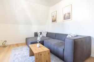 Posezení v ubytování Villa Dornkamp 4 - Luxuriöse Ferienwohnung für 4 Personen inklusive Balkon und Sauna
