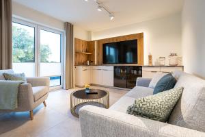 Kuchyň nebo kuchyňský kout v ubytování Dorumer Sielhuus 17 - Penthousewohnung mit Dachterrasse - strandnah