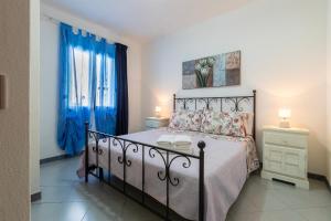 Ένα ή περισσότερα κρεβάτια σε δωμάτιο στο La Casa Di Rosa