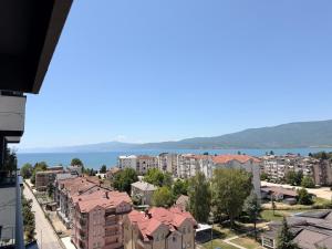 a view of a city with buildings and the water at EasyStay by Fuat in Struga