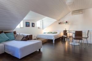 a room with a couch and a bed and a table at Apartment Dubravka Iza Roka in Dubrovnik