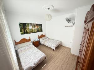 Posteľ alebo postele v izbe v ubytovaní Pacoplaza