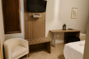 Letto o letti in una camera di Albergo Reale