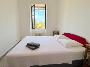 Postel nebo postele na pokoji v ubytování L'appartement Pianosa