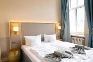 Postel nebo postele na pokoji v ubytování Hotel Germania