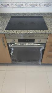 a stove top oven sitting on top of a counter at Ciudad De Sada in Sada