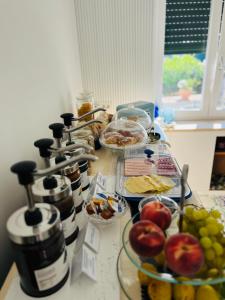 a table topped with plates of food and fruit at B&B L'Agapanto in Capri