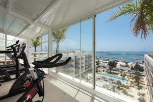 a gym with a view of the ocean at Del Mar Apartment - BT in Olhão