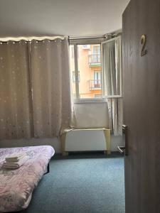 a bedroom with a bed and a window at Hotel Antonelli in Milan