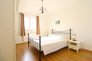 a bedroom with a bed and a window at Apartments Tamara 2397 in Fažana