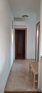 an empty hallway with a couch and a room at House Baglija in Lumbarda