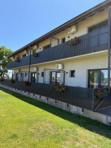 a building with flowerpots on the side of it at PENSIUNEA ANA in Piatra Neamţ