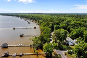 an aerial view of a river with a dock at Lake Escape - Lake Waccamaw home in Lake Waccamaw