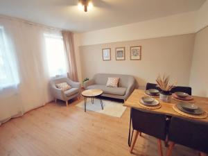 a living room with a couch and a table at Sonthofen erleben in Sonthofen