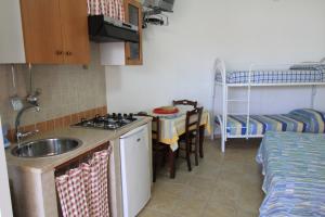 Kuchyň nebo kuchyňský kout v ubytování B&B Monterossi