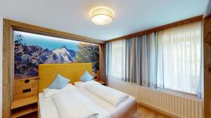 Postel nebo postele na pokoji v ubytování Hotel - Restaurant - Sonnblick