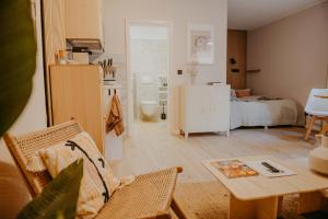 a living room with a couch and a table at sleepArt hygge in Celle