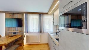 Kuchyň nebo kuchyňský kout v ubytování Hotel - Restaurant - Sonnblick