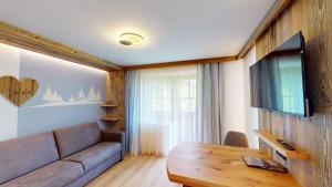 TV a/nebo společenská místnost v ubytování Hotel - Restaurant - Sonnblick