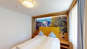 Postel nebo postele na pokoji v ubytování Hotel - Restaurant - Sonnblick
