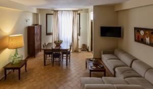 a living room with a couch and a table at Casa Praia in Favignana
