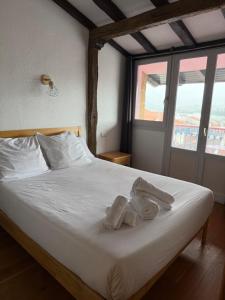 Postel nebo postele na pokoji v ubytování Hotel San Nikolas Sea Views