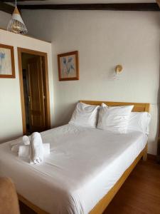 Postel nebo postele na pokoji v ubytování Hotel San Nikolas Sea Views