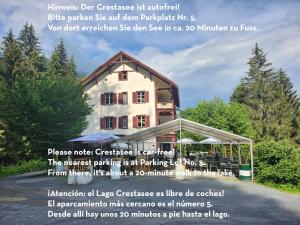 a poster of a house with a quote at Gasthaus Crestasee in Flims