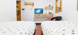 Postel nebo postele na pokoji v ubytování 老门客栈