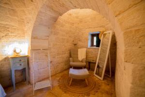 a bathroom with a toilet and a sink in a room at Come una volta - Il Trullo in Alberobello +33 photos
