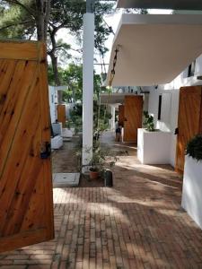 a room with a wooden door and a courtyard at Multiproprietà presso hotel kyrie in San Domino +2 photos