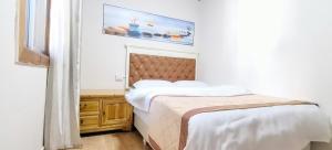 Postel nebo postele na pokoji v ubytování 老门客栈