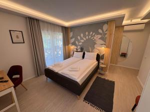 En eller flere senge i et værelse på Vila Salt & Soul