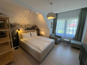 En eller flere senge i et værelse på Vila Salt & Soul