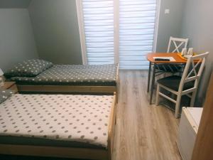 Posteľ alebo postele v izbe v ubytovaní Dobra Nocka