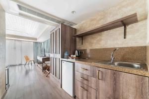 a kitchen with a sink and a counter top at Castle Franco Suites in Istanbul