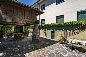an outdoor patio with a table and a building at Casa Rural Casa Mario in Cangas del Narcea