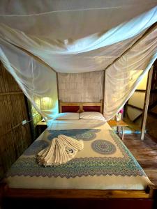 Voodi või voodid majutusasutuse Hostal Olmito Canoa toas